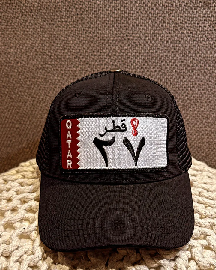 Black Point A cap with a Qatar plate